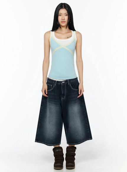 Back Print Jorts IL509 Dark blue full-length front view on model wearing blue colorblock lace tank top, standing straight, brown wedge sneakers