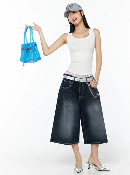 Back Print Jorts IL509 Dark blue full-length front view on model wearing white tank, cap, silver belt chain, holding blue bag, silver heels