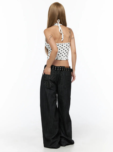 Baddie Polka Dot Halter Top CU524 White full-length back shot on model showing open back halter tie detail, ruched sides, black polka dot print, with dark wide-leg jeans