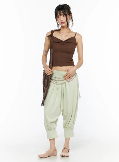 LEWKIN Balloon Joggers CU530 light green front view on model wearing brown cami top, chain belt accent, relaxed harem silhouette with elastic cuffs
