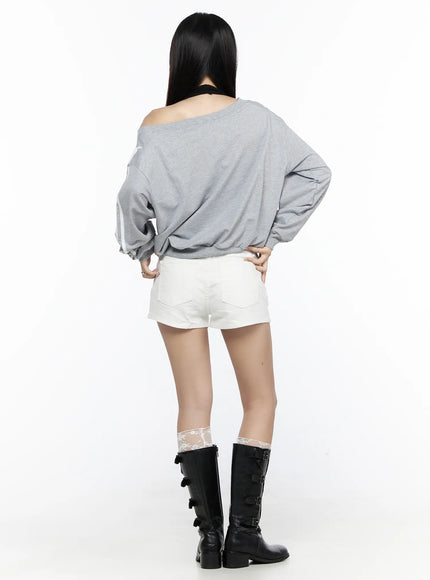 Banded Cotton Shorts CL527 White S back full-body shot on model with gray sweatshirt hands on waist showing white denim shorts rear and buckle boots