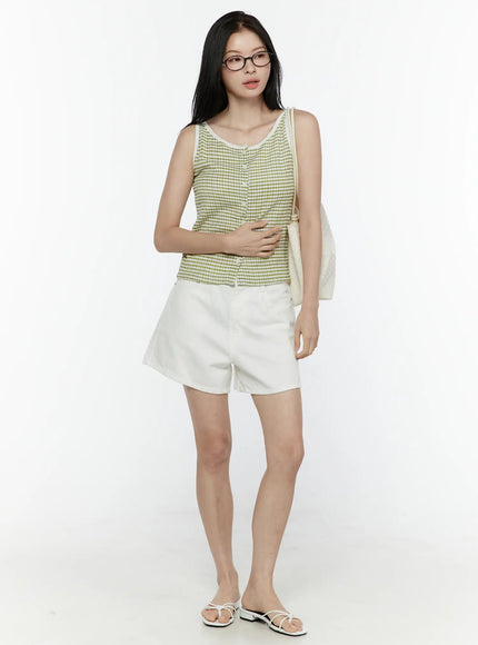 Basic Cotton Shorts IL506 White full-body front view on model with glasses and tote bag, styled with green gingham tank, white strappy sandals, casual summer look