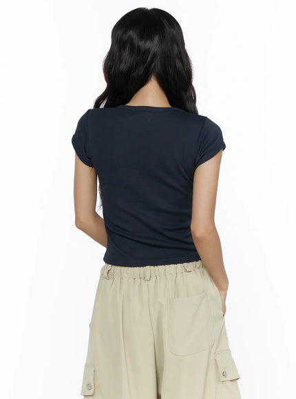 Basic Crewneck Tee CL510 Dark blue back shot on model showing clean smooth back, cap sleeves, and fitted cropped silhouette paired with beige cargo pants