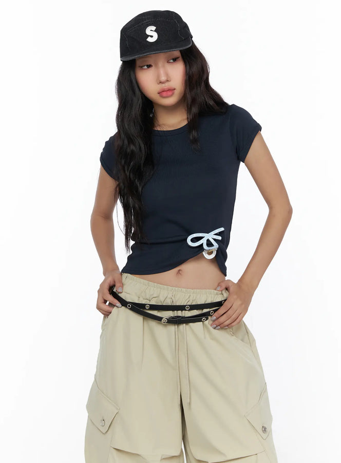 LEWKIN Basic Crewneck Tee CL510 Dark blue front shot on model size S/M with light blue bow detail, styled with beige cargo shorts and black cap