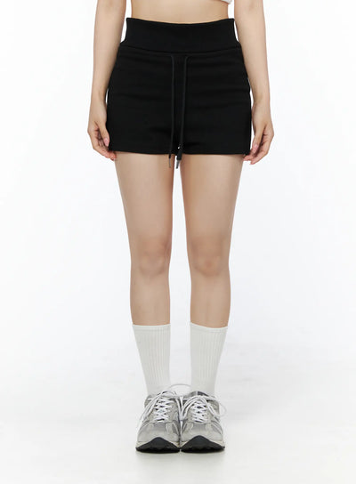 LEWKIN Basic Drawstring Lounge Shorts IU525 Black front close-up on model size S/M showing wide ribbed waistband and drawstring tie