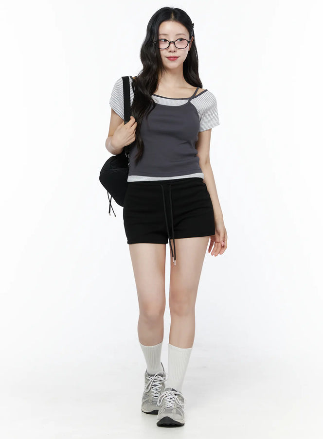 Basic Drawstring Lounge Shorts IU525 Black full-body front shot on model styled with striped raglan tee, backpack, white socks and sneakers