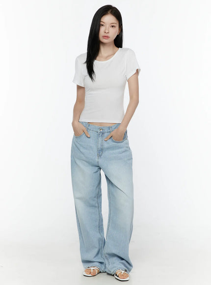 LEWKIN Basic Round Neck Tee IL506 White front full-body model shot, slim crop fit with short sleeves, styled with light blue striped wide-leg jeans and white sandals
