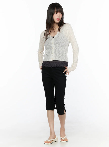 Basic Slit Cotton Capri Pants CL522 Black full-length front shot on model looking down styled with cream sheer knit cardigan and lace top