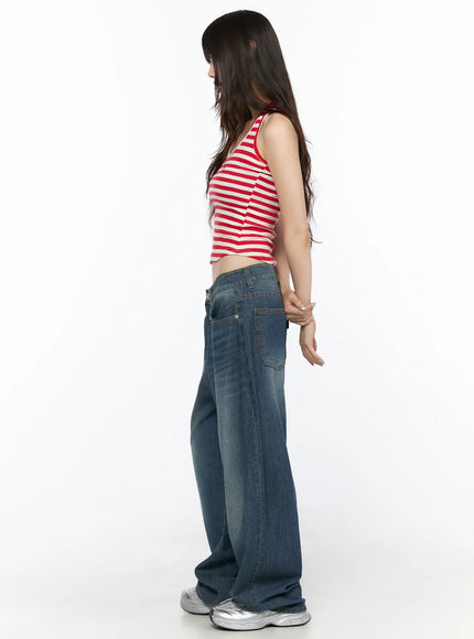 Basic Striped Halter Top CL522 Red side view on model showing crop length ribbed stripe fabric and racerback strap detail with wide-leg jeans