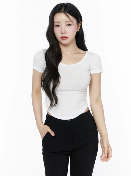 Basic U-Neck Tee IU525 White front shot on model hand in pocket U-neckline ribbed crop top with black high-waist trousers casual styling