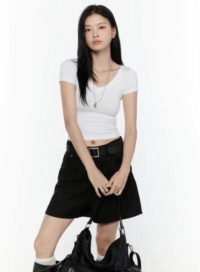 LEWKIN Basic V-Neck Crop Top IL506 White front view on model size S/M styled with black shorts belt and bag