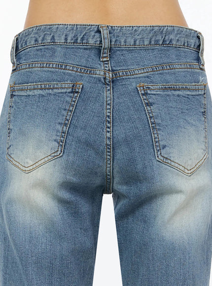 Bay Low Rise Bootcut Jeans IL509 Blue close-up back detail shot showing two curved back pockets amber stitching and faded wash texture on denim