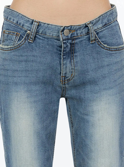 Bay Low Rise Bootcut Jeans IL509 Blue close-up detail shot of front waistband showing V-notch low-rise cut silver button and amber contrast stitching