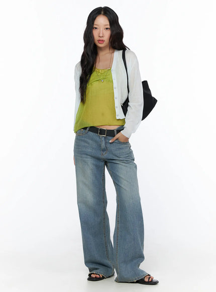 Beau Low-Rise Wide Jeans CL510 Blue full-body front view on model styled with white cardigan, lime green top, black belt and bag, wide-leg denim
