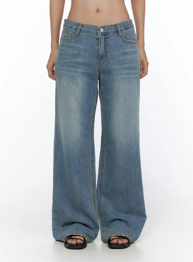 LEWKIN Beau Low-Rise Wide Jeans CL510 Blue front view on model, low-rise V-waistband, wide-leg washed denim, worn with black sandals, size S