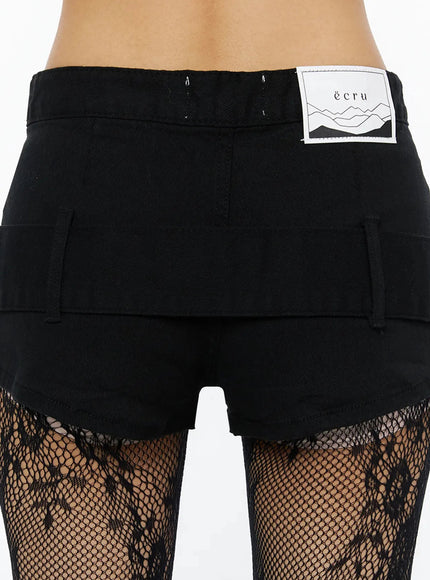 Belt Detail Micro Shorts IL509 Black close-up back detail showing ecru woven label, waist hook, double back cargo pockets over lace tights
