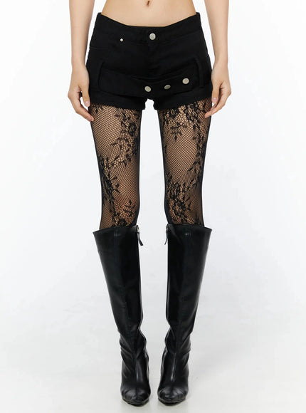 LEWKIN Belt Detail Micro Shorts IL509 Black front view on model wearing lace fishnet tights and knee-high boots, size S