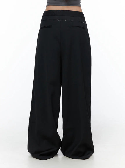 Belted Pintuck Wide Slacks CL510 black back shot on model showing wide-leg silhouette rear view with layered waistband and back pocket detail