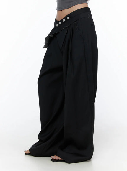 Belted Pintuck Wide Slacks CL510 black side shot on model wearing gray crop top and carrying large tote bag showing full-length wide-leg drape