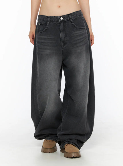 Ben Washed Wide Leg Jeans CL501 Black front crop shot on model showing wide balloon leg silhouette, mid-rise fit, faded wash, and ruched hem at boots