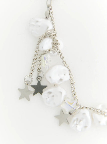 Blair Baroque Necklace IL522 silver close-up detail of left side showing baroque pearls iridescent crystal beads and layered silver star charms on fine chain