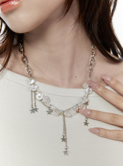 LEWKIN Blair Baroque Necklace IL522 silver close-up on model showing baroque pearl beads crystal accents and dangling star charms worn over white top