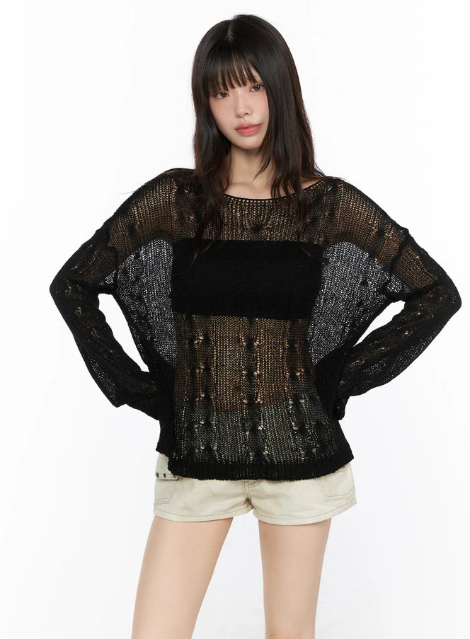 Boat Neck Sheer Cable Knit Top CL522 Black front model shot hands on hips showing sheer open-knit texture and boucle chest panel