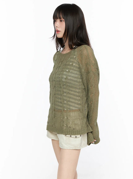 Boat Neck Sheer Cable Knit Top CL522 Dark green angled side model shot close-up of sheer cable knit texture and ribbed hem with shorts