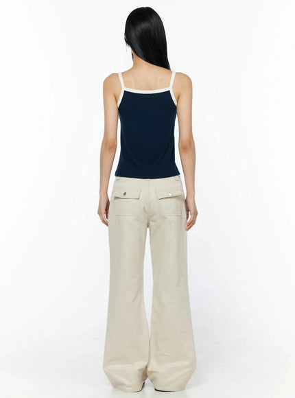 Bootcut Cargo Pants IL516 Light beige back full-length view on model, showing rear flap pockets and wide hem sweep, paired with navy cami top