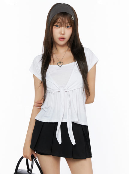 LEWKIN Bow-Detail Tank Set IL523 White S/M front shot on model wearing headband, front-tie bow detail, layered tank, soft jersey fabric, styled with black mini skirt