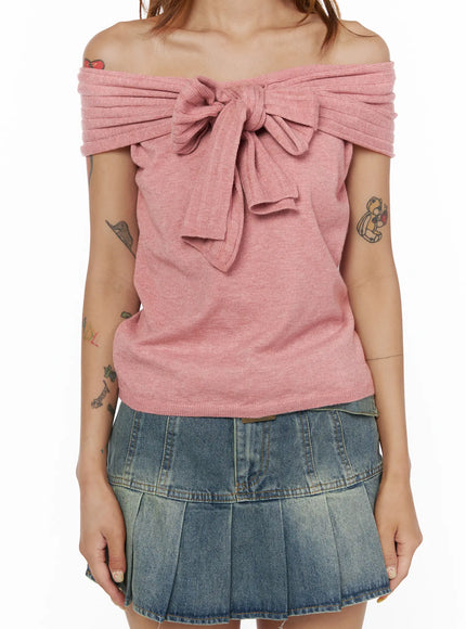 Bow Off-Shoulder Top CL503 Pink close-up front detail on model showing ribbed off-shoulder band, center knot bow tie and soft heathered knit fabric texture