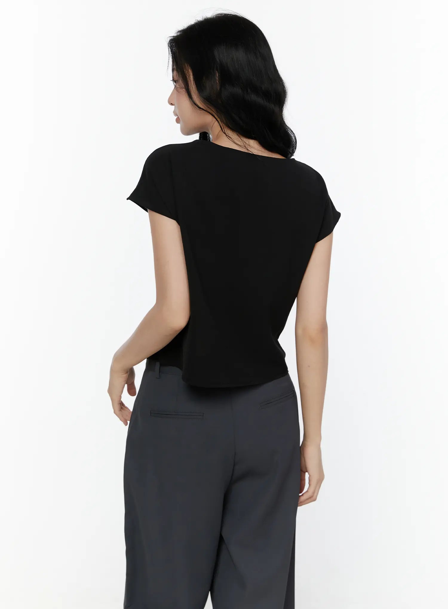 Bow Tie Cap Sleeve Blouse CL520 Black back shot on model showing clean smooth back cap sleeves and fitted waist silhouette