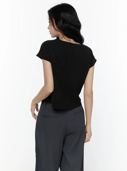 Bow Tie Cap Sleeve Blouse CL520 Black back shot on model showing clean smooth back cap sleeves and fitted waist silhouette