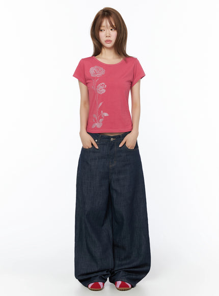 Brinny Vintage Wide-Leg Jeans IU525 Dark blue full-body front shot on model with hands in pockets paired with pink rose rhinestone crop tee standing straight