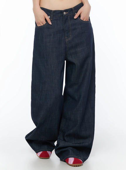 Brinny Vintage Wide-Leg Jeans IU525 Dark blue front waist-to-hem shot on model hands in front pockets highlighting extreme wide-leg balloon leg shape and silver button