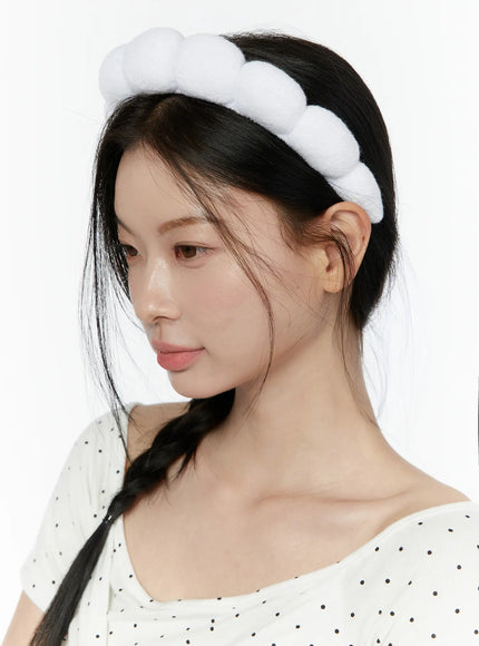 Bubble Headband IL506 White side-view close-up model wearing white terry bubble headband showing scalloped texture along hairline