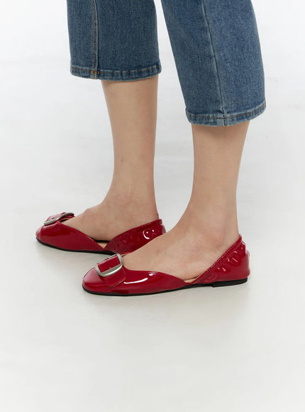 Buckle Detail Flats CU530 Red side shot on model wearing blue denim cropped jeans, glossy patent leather slingback silhouette with silver buckle detail