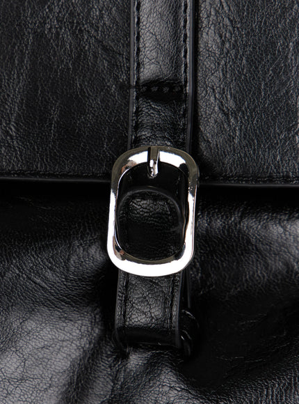 Buckle Faux Leather Shoulder Bag IL523 Black close-up side detail showing D-ring hardware side pocket and crinkled glossy faux leather texture