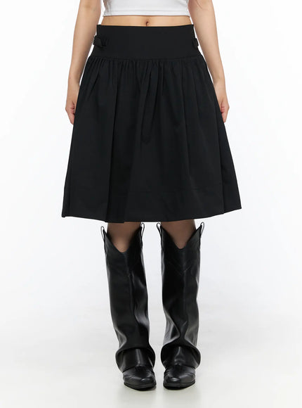 Buckle Midi Skirt CL517 Black front model shot cropped at waist showing full gathered A-line skirt with wide waistband and cowboy boots, model standing straight