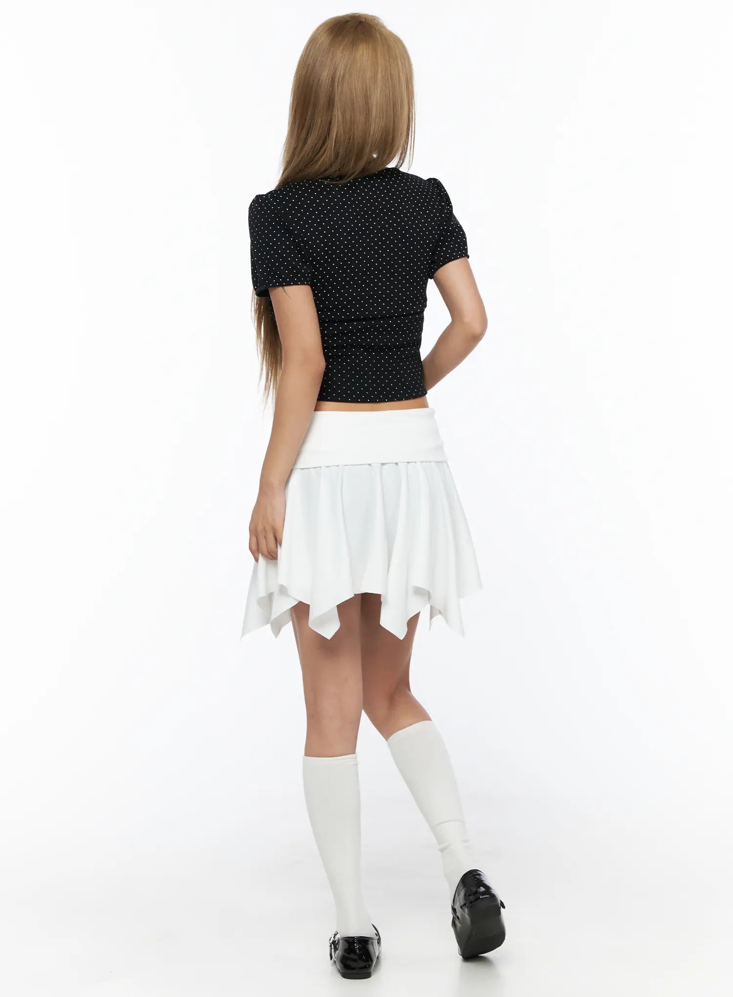 Button Flare Mini Skirt CU524 White full-body back shot on model with black polka dot crop top and white knee socks, back-facing standing pose