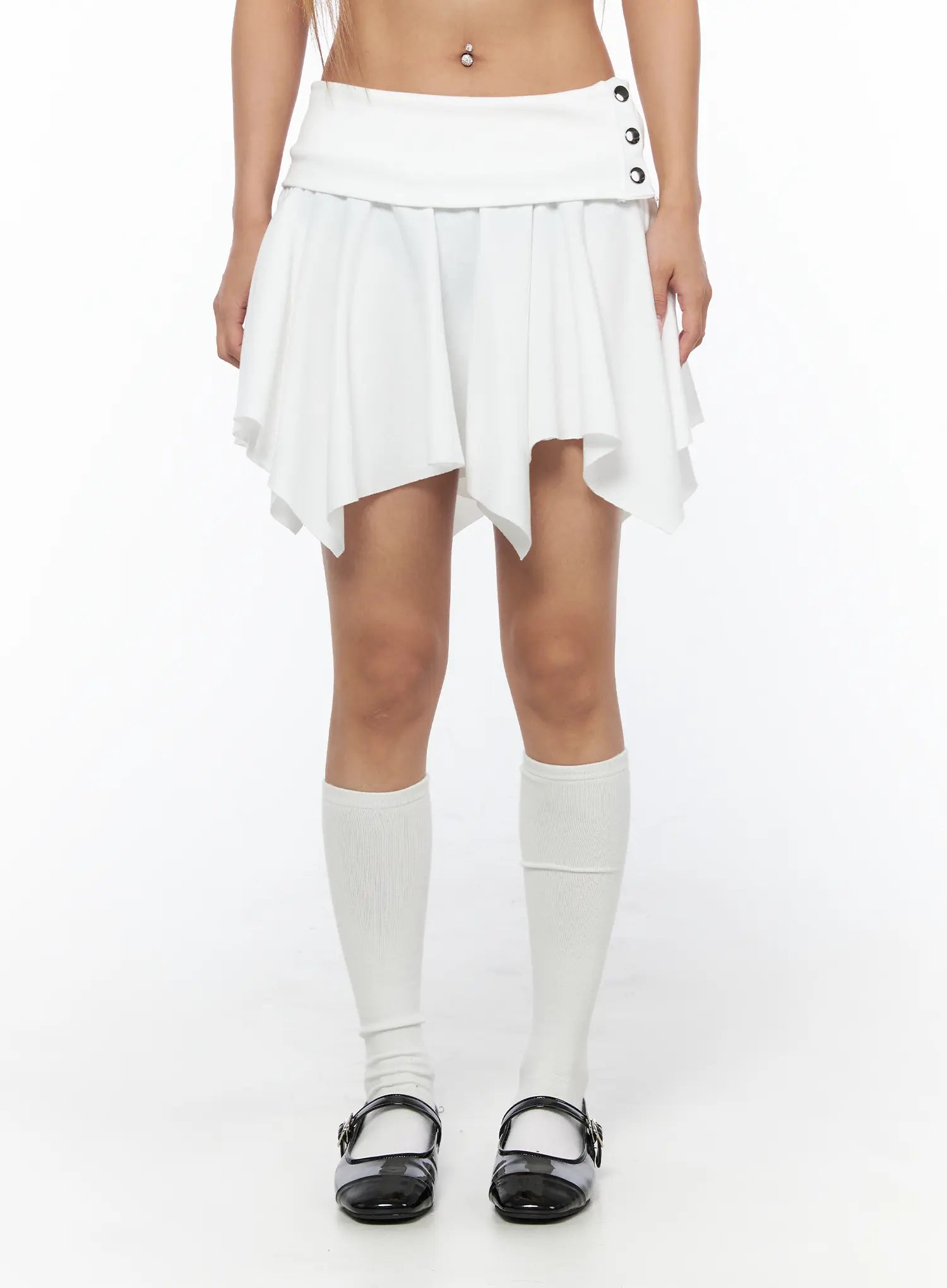 Button Flare Mini Skirt CU524 White front shot on model showing full skirt silhouette with button waistband, handkerchief hem, and white knee socks