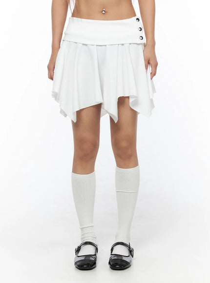 Button Flare Mini Skirt CU524 White front shot on model showing full skirt silhouette with button waistband, handkerchief hem, and white knee socks