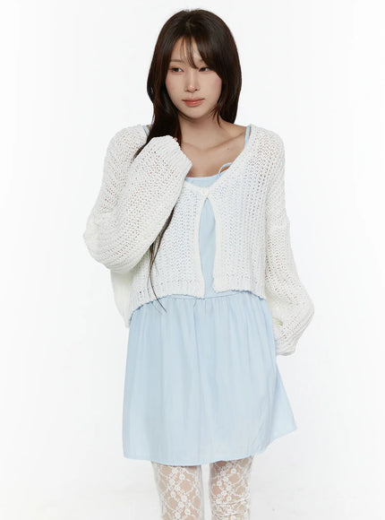 LEWKIN Button Knit Cardigan CL508 White front shot on model size S/M with open-knit cropped silhouette, single button closure, layered over light blue dress with lace tights
