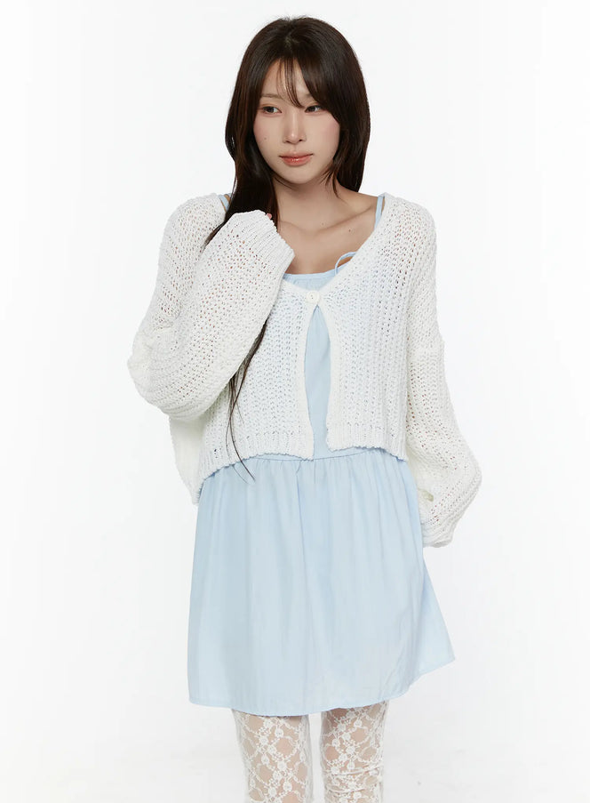 LEWKIN Button Knit Cardigan CL508 White front shot on model size S/M with open-knit cropped silhouette, single button closure, layered over light blue dress with lace tights