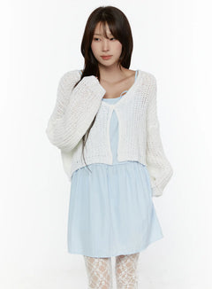 LEWKIN Button Knit Cardigan CL508 White front shot on model size S/M with open-knit cropped silhouette, single button closure, layered over light blue dress with lace tights
