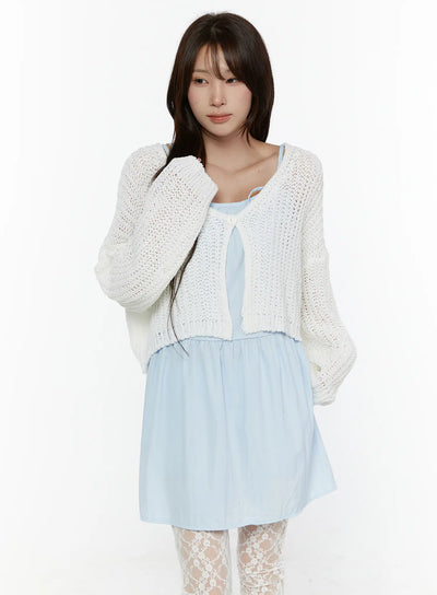 LEWKIN Button Knit Cardigan CL508 White front shot on model size S/M with open-knit cropped silhouette, single button closure, layered over light blue dress with lace tights