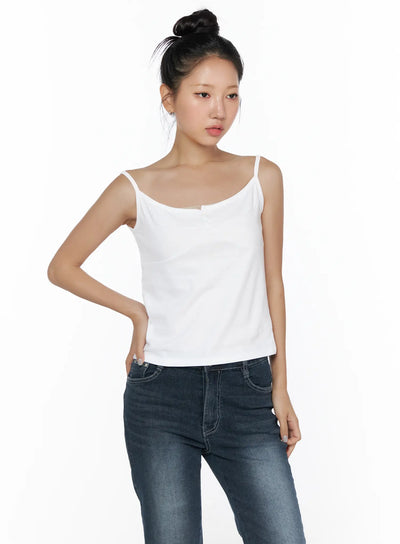 LEWKIN Button Sleeveless Top CL510 White front view on model wearing bun updo paired with dark skinny jeans size S/M