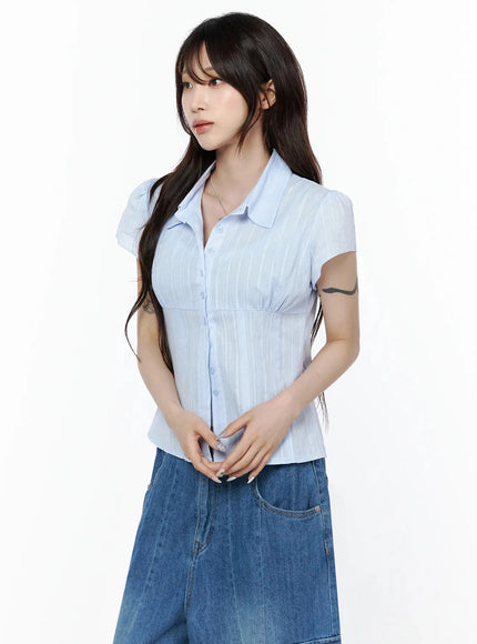 Button Up Linen Summer Blouse IL506 Light blue full-body front shot on model standing straight styled with wide-leg cargo jeans and belt