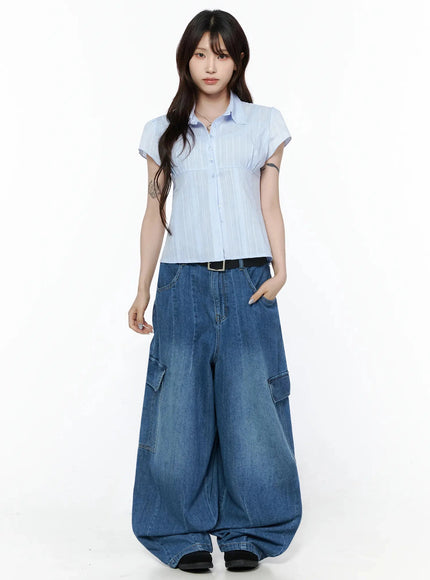 Button Up Linen Summer Blouse IL506 Light blue full-body three-quarter front shot on model with hand in pocket showing cropped hem length