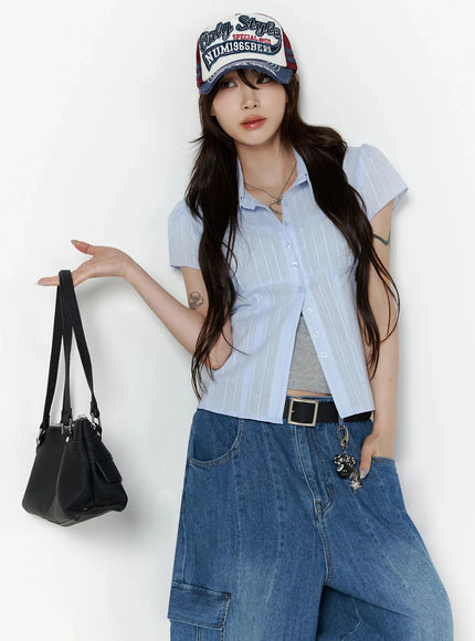 LEWKIN Button Up Linen Summer Blouse IL506 Light blue S/M cropped front shot on model wearing cap and cargo jeans holding black bag